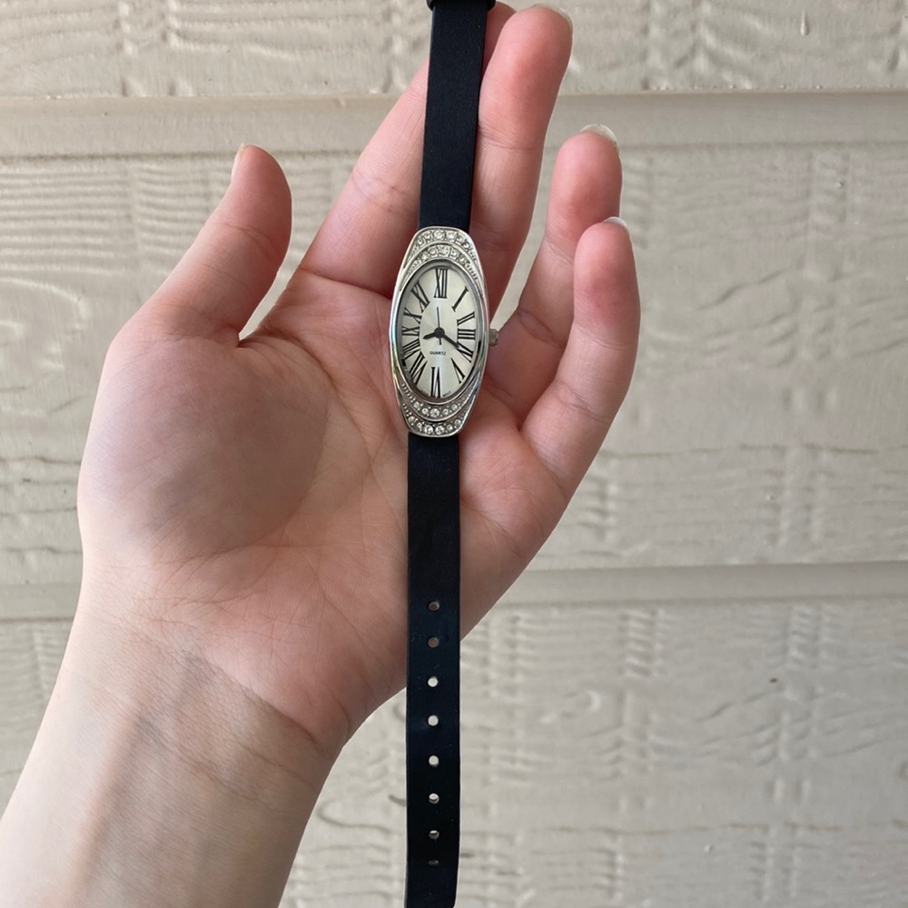 Silver-tone Avon Watch with Black Straps